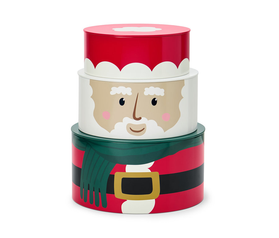 Ein Satz von drei Keksdosen mit Weihnachtsmotiv, die aufeinander gestapelt sind.