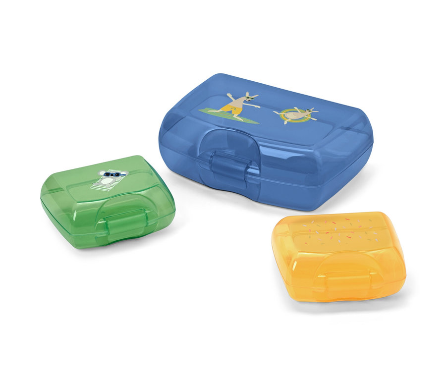 Drei Brotdosen in Blau, Grün und Gelb.