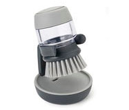 Joseph Joseph Spülbürste mit Spülmittelspender in Grau auf Abtropfschale.