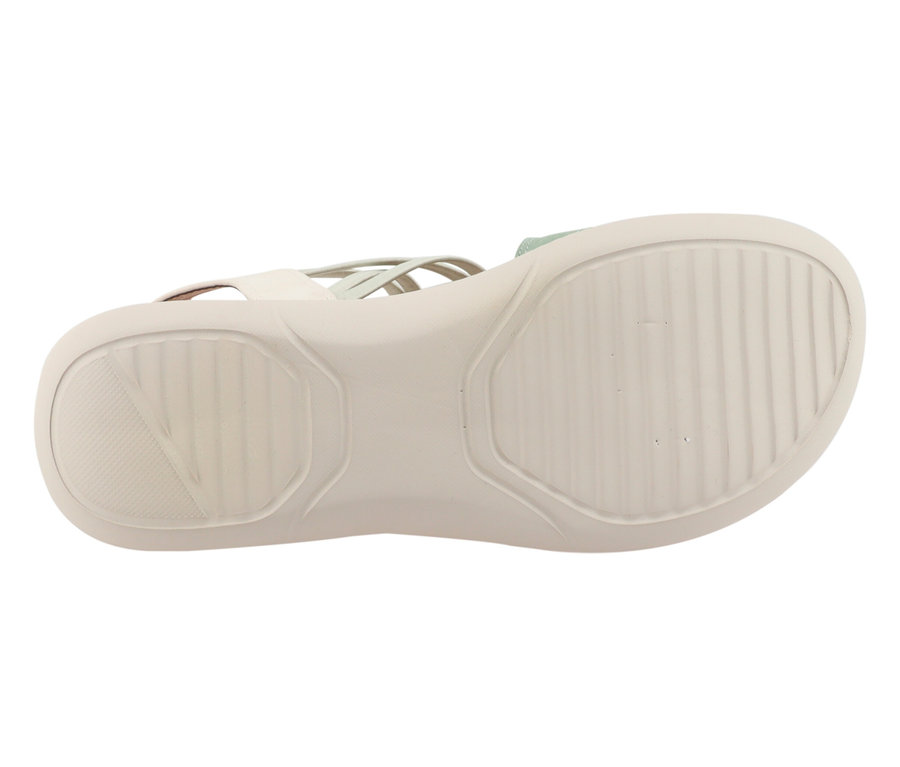 Sohle eines hellen Sandalenschuhs mit Riemchen.