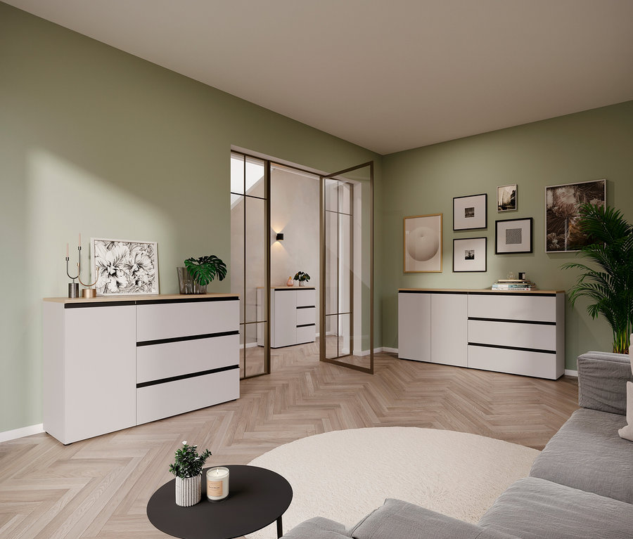 Wohnzimmer mit Sideboard »Cormano», Couch, rundem Teppich und Deko vor hellgrüner Wand.