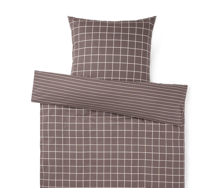 Bettwäsche-Set in Anthrazit mit weißem Karomuster. Ein umgeschlagener Teil zeigt ein Streifenmuster.