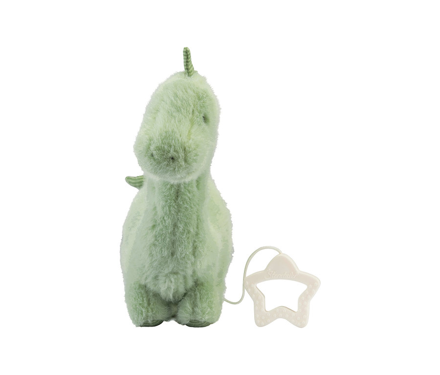 Ein hellgrünes, flauschiges Dinosaurier-Plüschtier mit einem sternförmigen Zugband an der Seite.