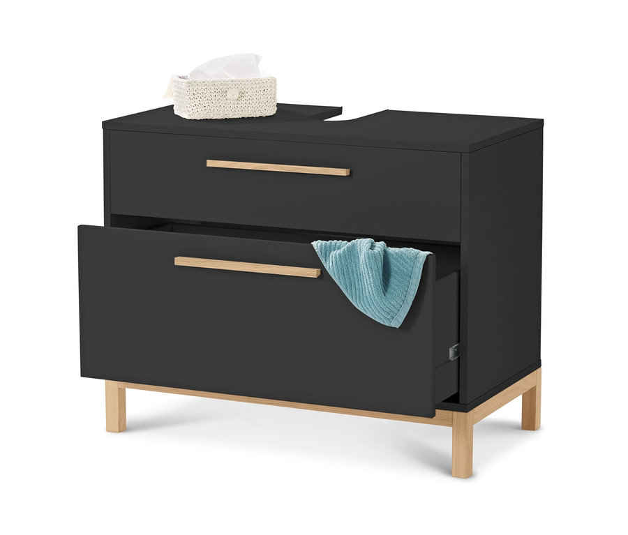 Ein schwarzer Waschtischunterschrank mit zwei Schubladen, auf dem sich eine Packung Taschentücher befindet und an der unteren Schublade ein türkisfarbenes Handtuch hängt.