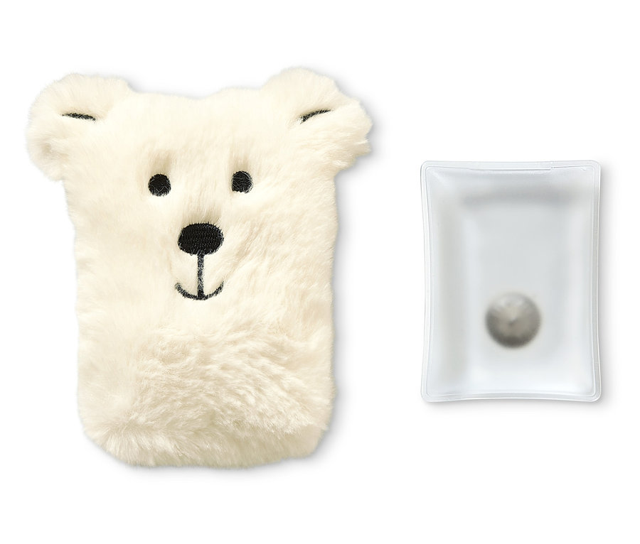 Ein bärenförmiger Taschenwärmer aus Plüsch und eine Wärmekapsel.