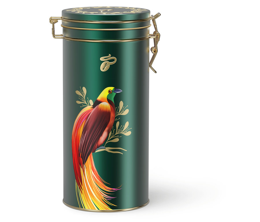 Eine grüne Kaffeedose mit goldenen Akzenten und einem bunten Vogelbild.