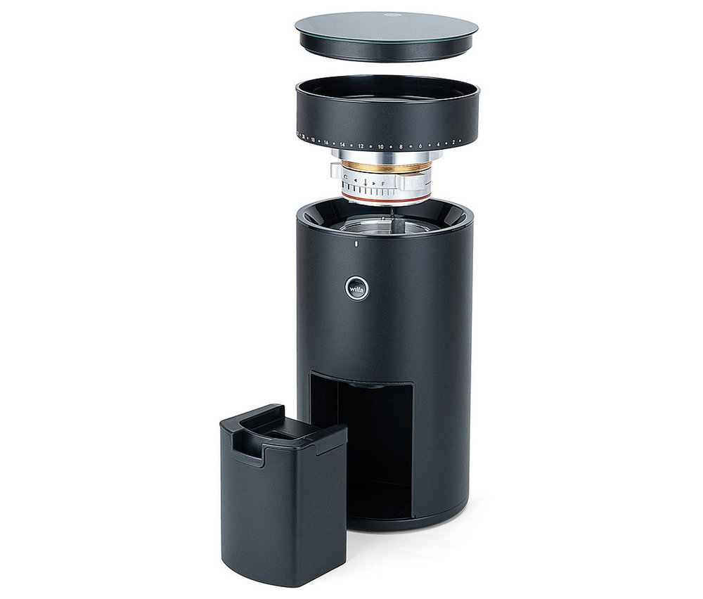 Schwarze Wilfa Uniform Evo CG4B-S150 Kaffeemühle mit Waage, zerlegt mit zylindrischem Gehäuse, Mahlwerk, Bohnenbehälterring, Glasdeckel und Auffangbehälter.