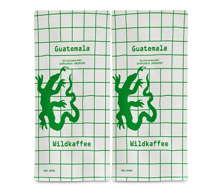 Zwei Packungen Wildkaffee - Guatemala San Lorenzo Omni-Roast - 2x 1 kg Ganze Bohne auf weißem Hintergrund.
