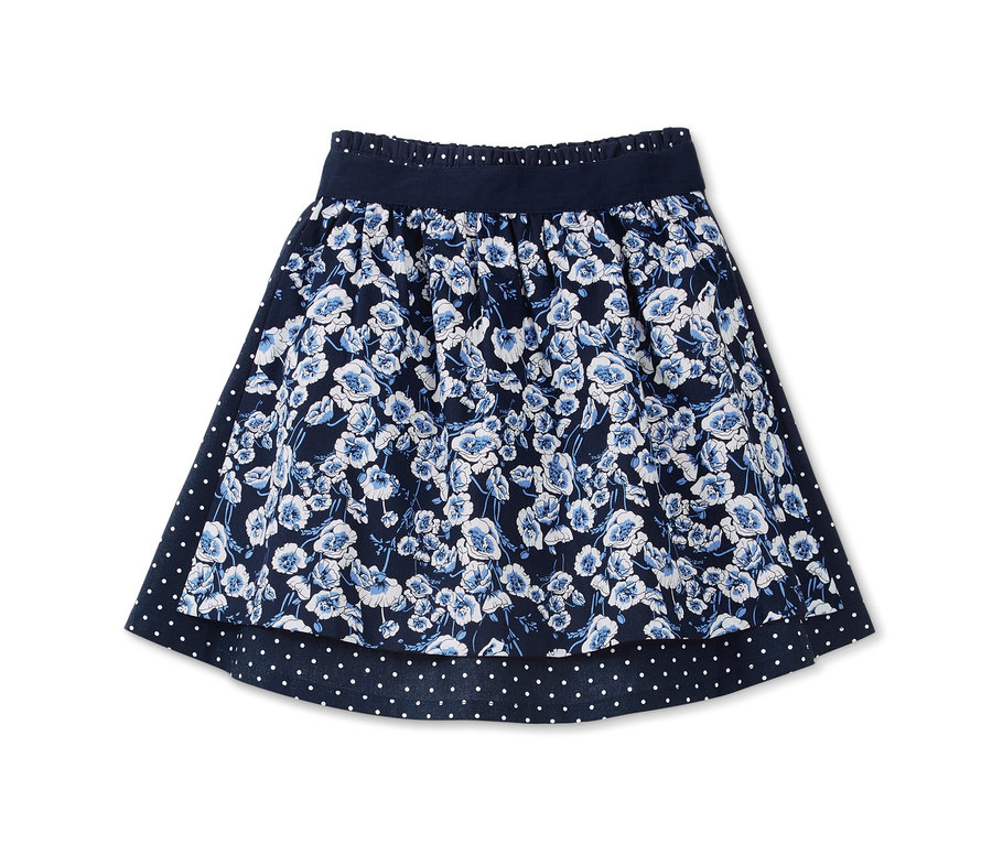 Blauer Rock mit Wendeschürze, Blumenmuster und Punkten.
