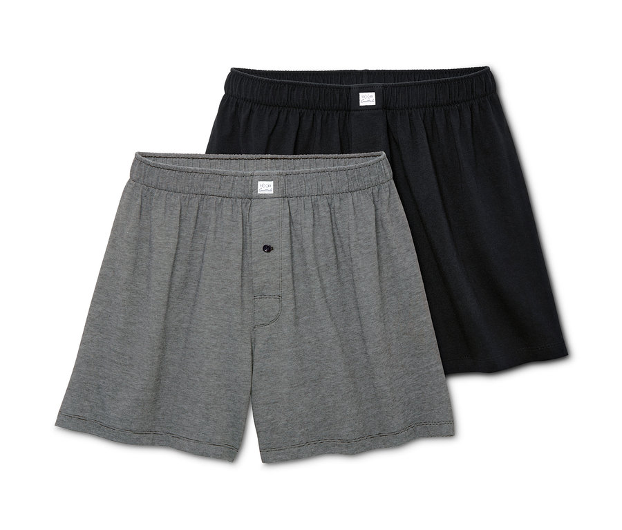 Zwei Jersey-Boxershorts, eine grau, eine schwarz.