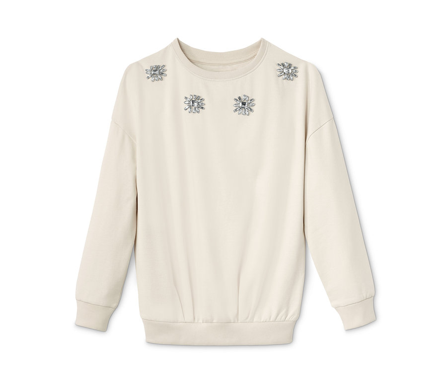 Ein cremefarbenes Sweatshirt mit Strassblumen.