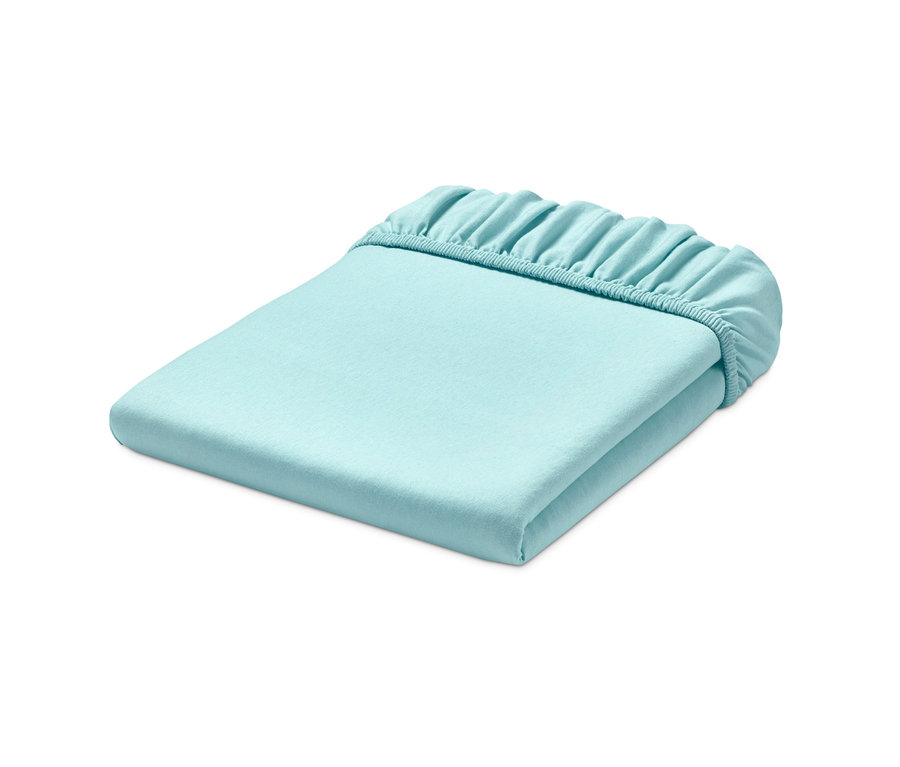 Ein gefaltetes mintfarbenes Jersey-Spannbettlaken.