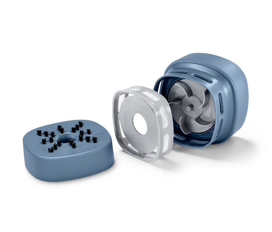 Teile des Mini-Tischstaubsaugers auf einem weißen Hintergrund.