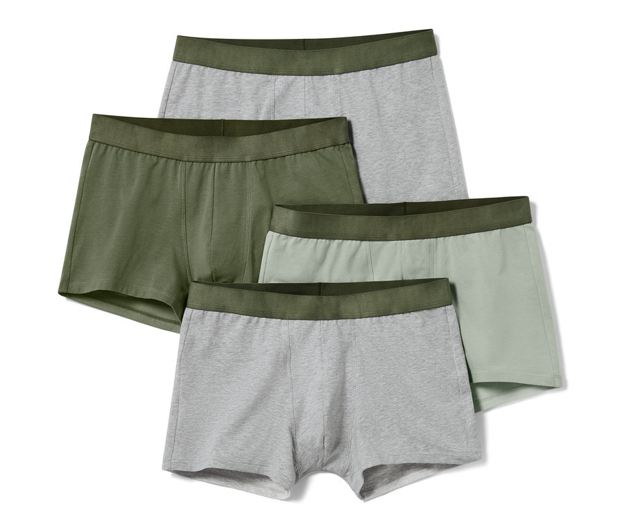 Vier Slipboxer: eine olivgrün, eine hellgrün und zwei grau, alle mit olivgrünem Bund.