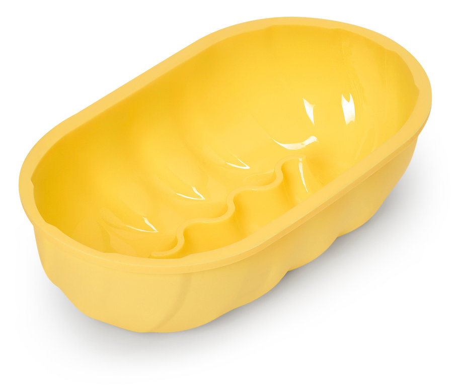 Gelbe, ovale Kuchenform mit gewelltem Boden.