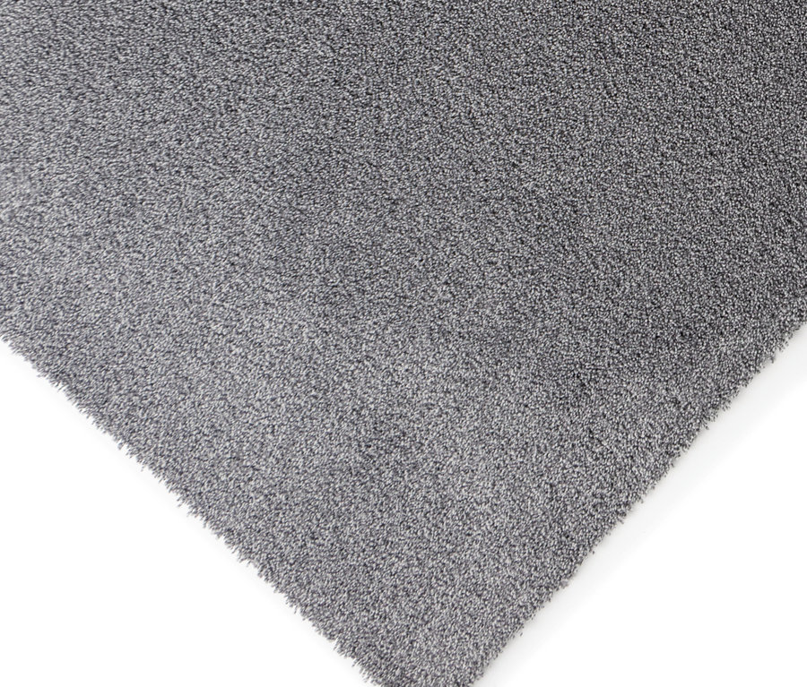 Nahaufnahme einer Ecke des grauen Teppichs »Jane«.