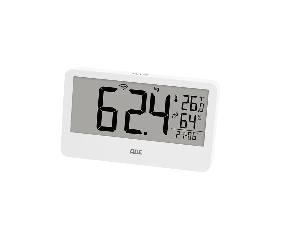 Weiße digitale Personenwaage mit Anzeige von 62,4 kg, 26,0 °C, 64 % Luftfeuchtigkeit und 21:06 Uhr.