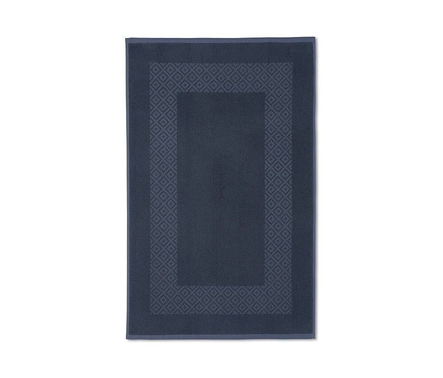 Blauer Wende-Duschvorleger mit geometrischem Muster.