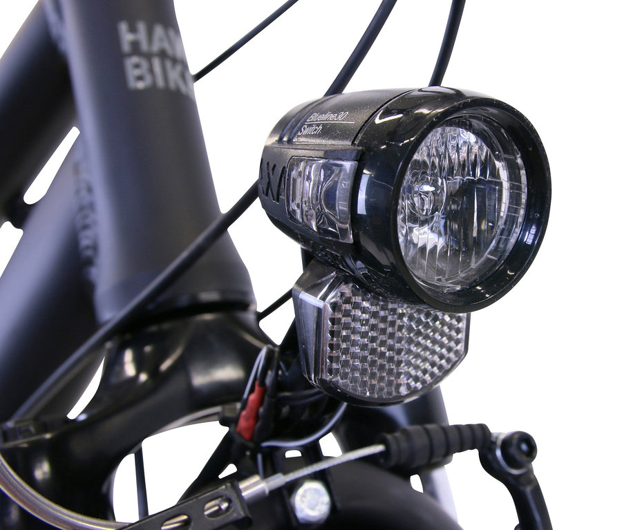 Detailaufnahme des Frontlichts und eines Teils des Rahmens vom HAWK Bikes Damen-Trekkingrad »Trekking Lady Premium«.