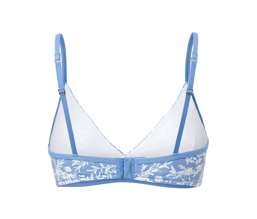 Detailaufnahme eines Soft-BHs mit Blumenmuster und blauen Trägern.
