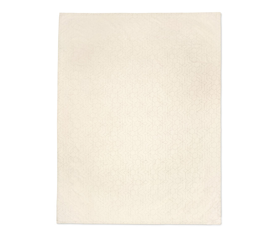 Eine cremefarbene Jacquard-Tischdecke mit Muster.