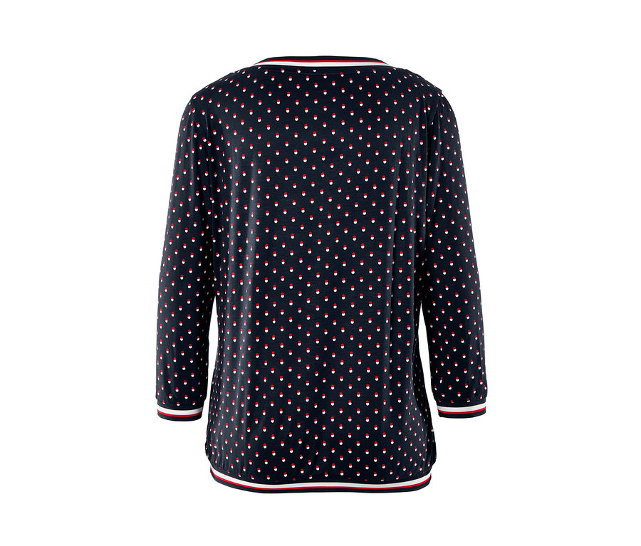 Blusenshirt mit 3/4-Arm mit marineblauem Hintergrund und roten und weißen Tupfen.