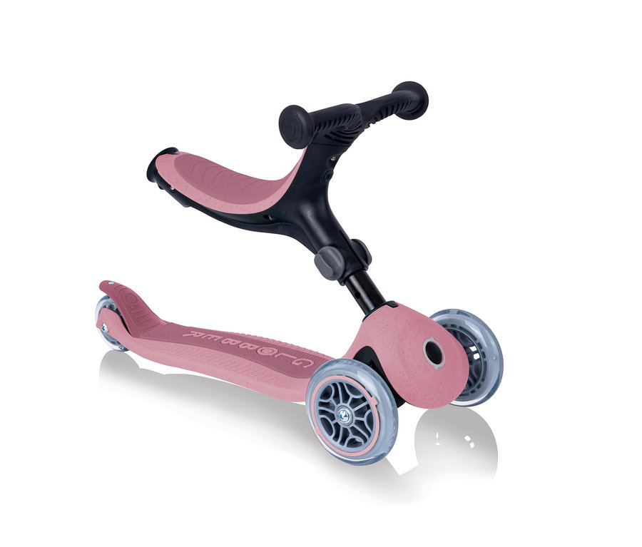 Ein pinker GLOBBER Roller »GO-UP Foldable Plus Eco« auf einem weißen Hintergrund.
