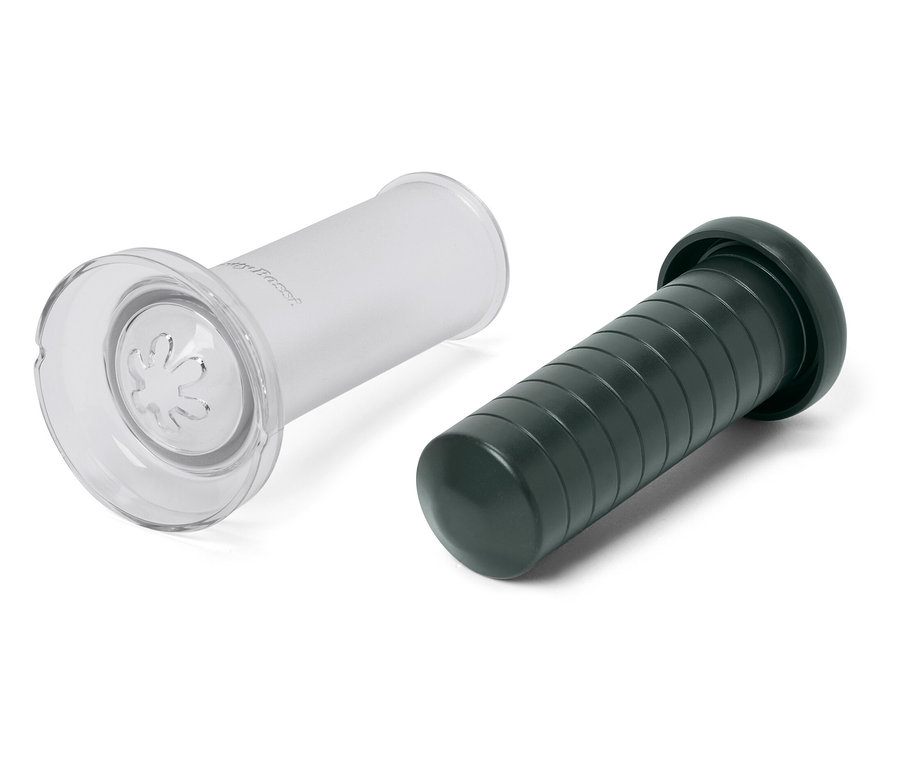 Eine durchsichtige Plastiksaugglocke und eine grüne Saugglocke auf weißem Hintergrund.