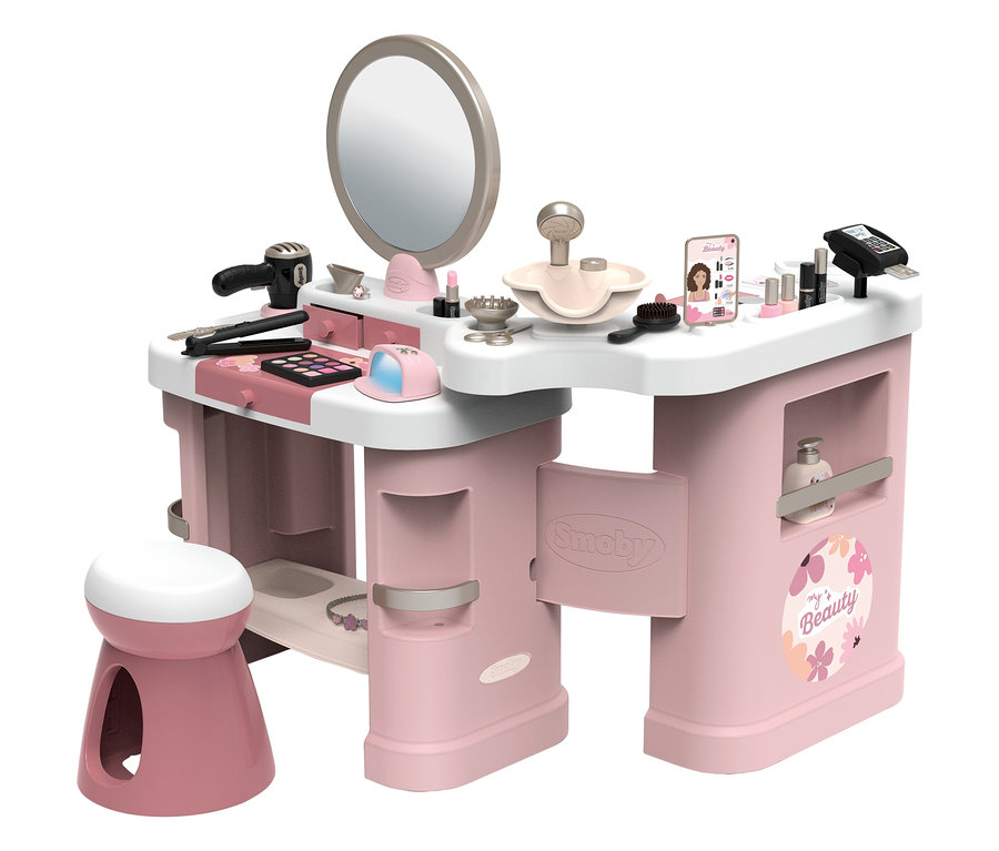 Rosa-weißer Schminktisch mit Spiegel, Hocker und Zubehör wie Fön, Make-up und Handy.