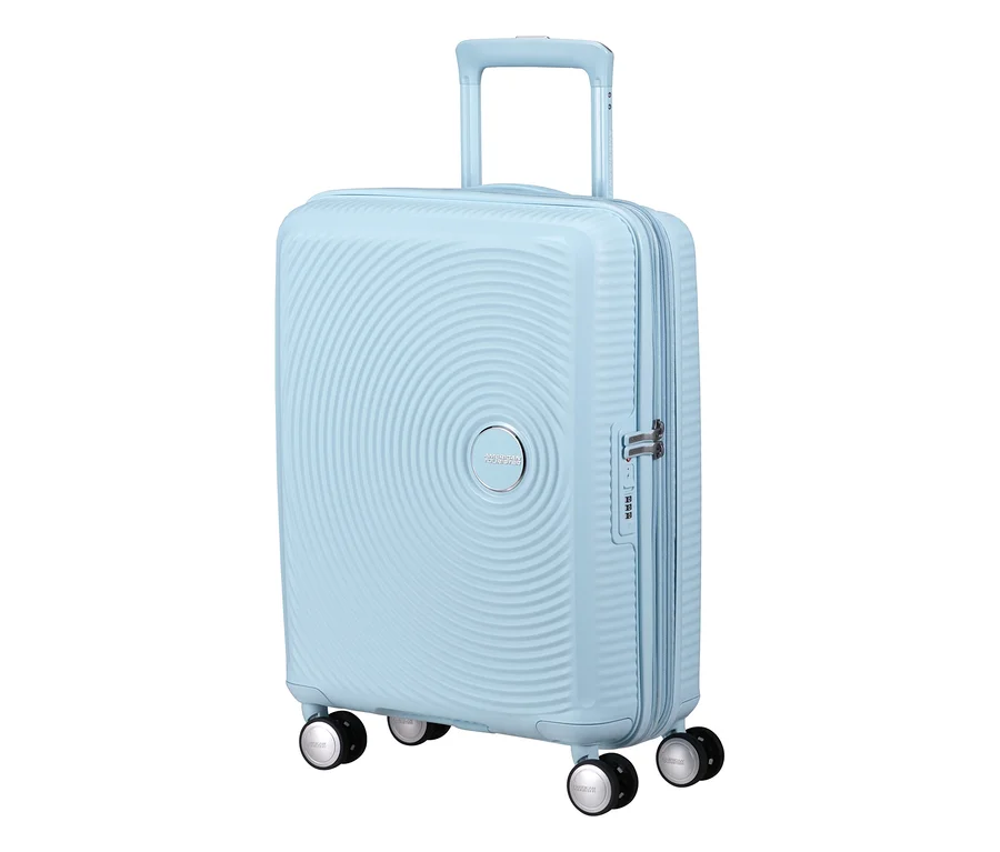 Pastellblauer American Tourister Hartschalen-Koffer Soundbox Spinner, klein, mit ausziehbarem Griff und vier Rollen.