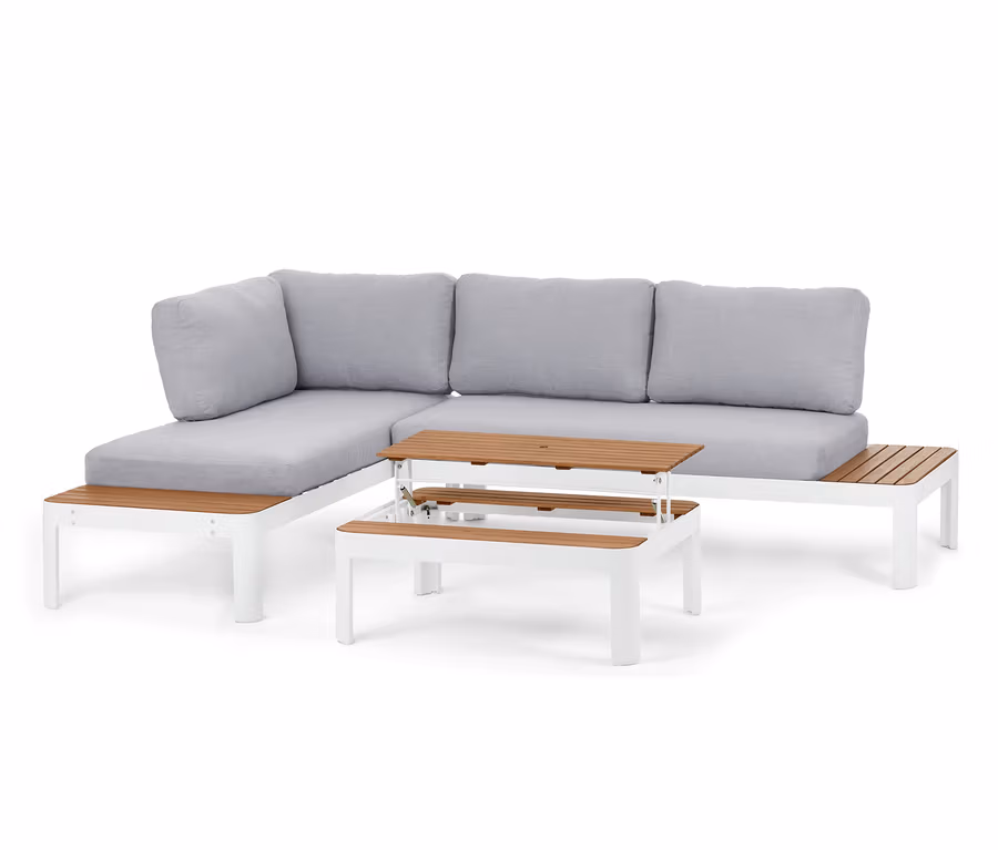 Ein Loungemöbel-Set, variabel, mit einer Lounge-Ecke mit höhenverstellbarem Couchtisch und grauen Kissen.