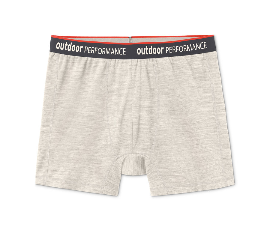 Nahaufnahme von hellbeigen 2 Slipboxern mit RWS-Wolle und einem schwarzen Bund mit der Aufschrift "Outdoor Performance".