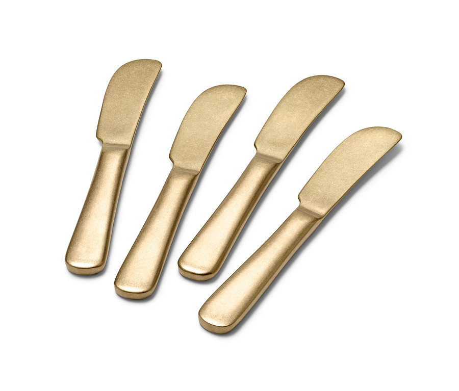 Vier goldene Buttermesser.