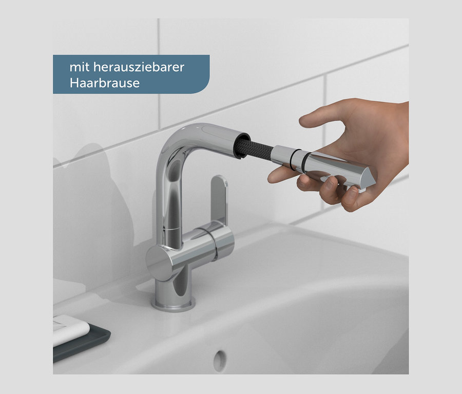 Eine Hand hält die ausziehbare Brause an der verchromten SCHÜTTE Waschtischarmatur »London«.