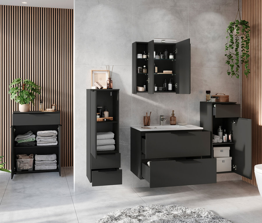 Ein Badezimmer mit Waschbecken, Toilette und Dalvik Schrank.