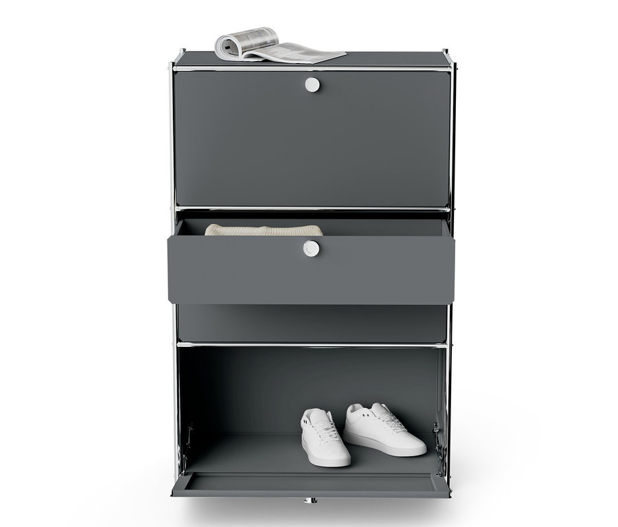 Graue Kommode Metall »CN3« mit 2 Klappenfächern, 2 Schubladen, einer Zeitung oben und Schuhen drinnen.