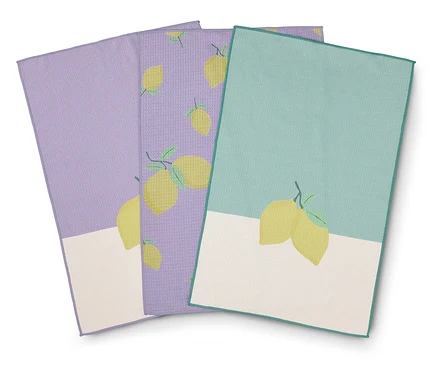 Drei Geschirrtücher mit Zitronenmuster in Lavendel, Lila und Türkis.