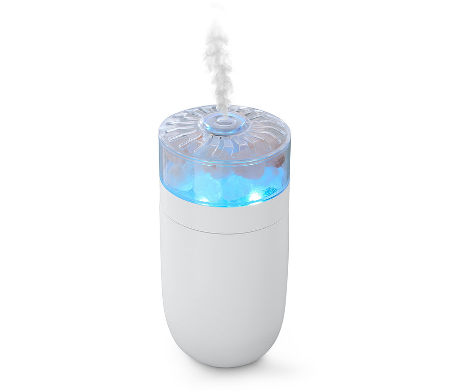 Weißer Luftbefeuchter mit blauem Licht und Dampf oben.