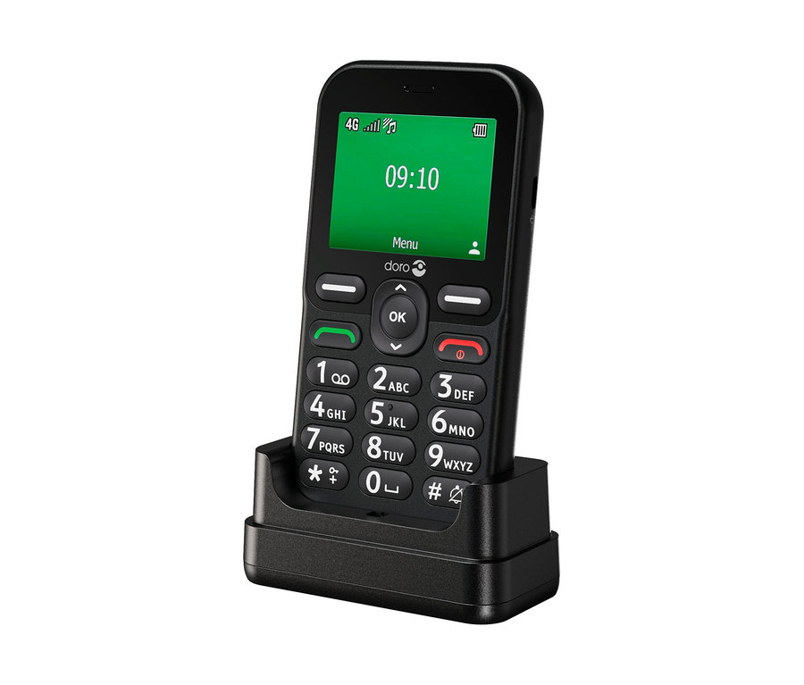 Ein schwarzes Doro Leva E10 LTE Mobiltelefon in einer Ladeschale, mit großem Tastenfeld und grünem Display, das 09:10 Uhr anzeigt.