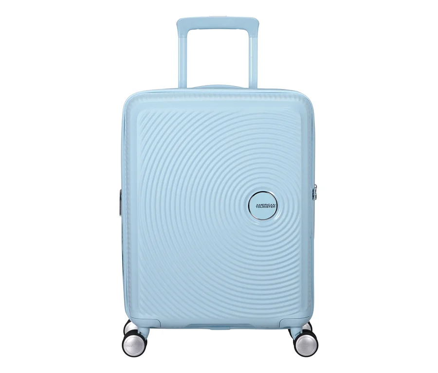 Pastellblauer American Tourister Hartschalen-Koffer Soundbox Spinner, klein, mit ausziehbarem Griff und vier Rollen.