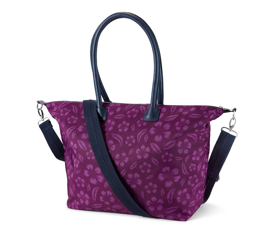 Lila Sicherheits-Shopper mit Blumenmuster und dunkelblauen Henkeln.