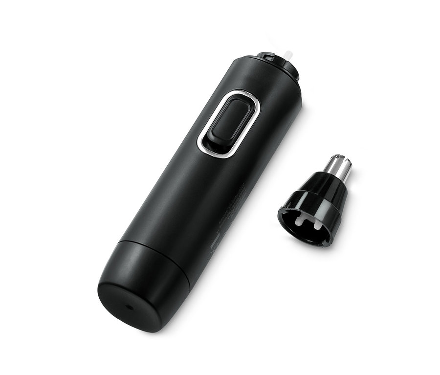 Ein schwarzer Nasen- und Ohrhaartrimmer und sein Aufsatz liegen auf einem weißen Hintergrund.