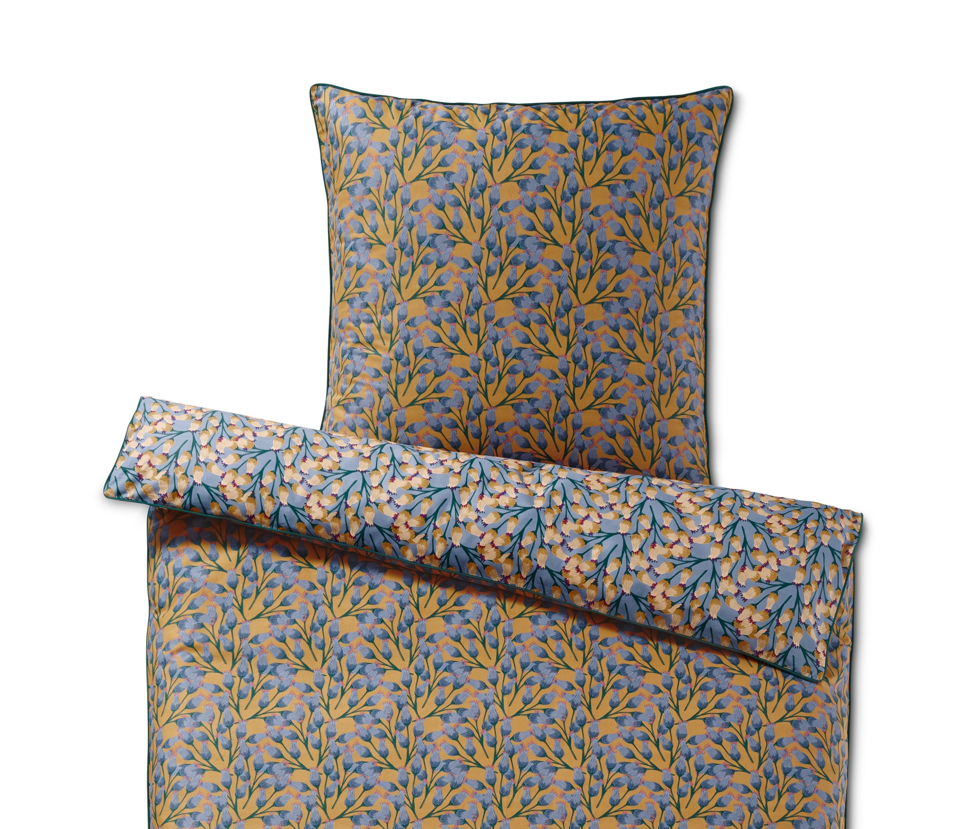 Gelbe und blaue Renforcé-Bettwäsche mit Blumenmuster.