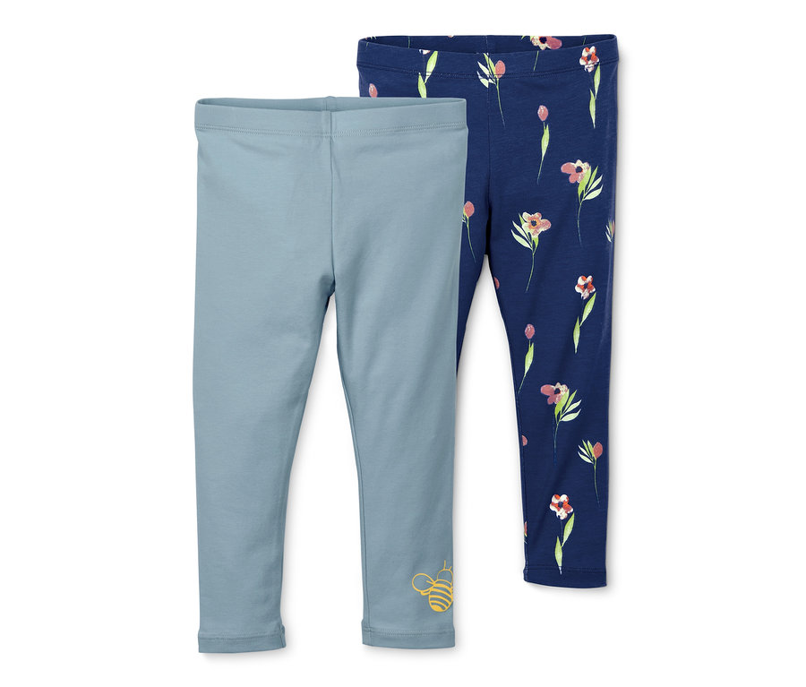 Zwei Leggings: eine hellblaue mit Bienenprint, die andere dunkelblaue mit Blumenmuster.