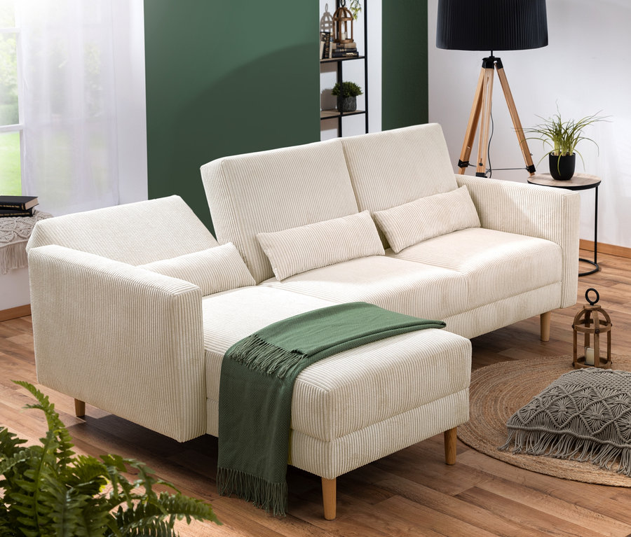 Ein cremefarbenes Federkern Eck-Schlafsofa »Jenna« steht im Wohnzimmer.