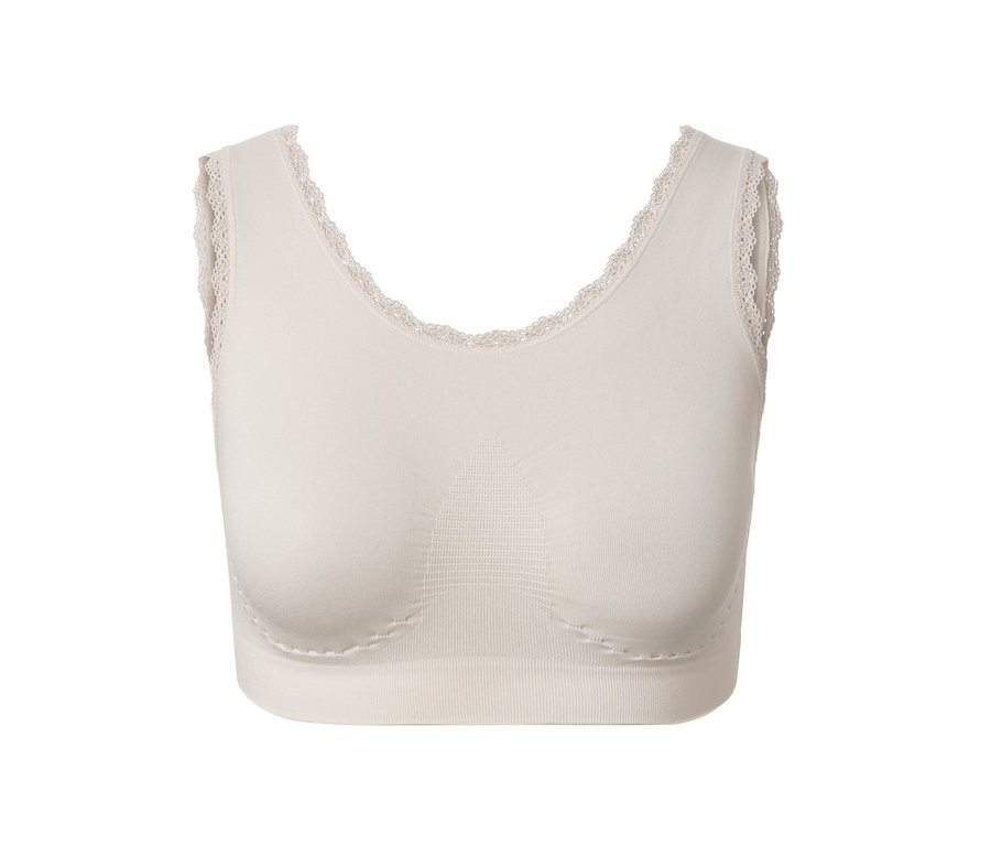Ein cremefarbenes Seamless-Bustier mit Spitze.