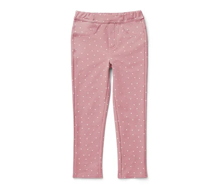 Rosa Kinder-Jeggings ‒ Fit »Ida« mit weißen Punkten auf weißem Hintergrund.