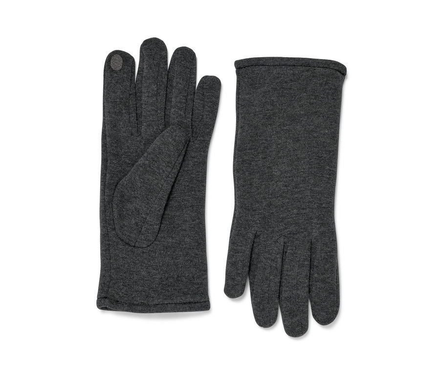 Zwei Sweathandschuhe liegen nebeneinander.