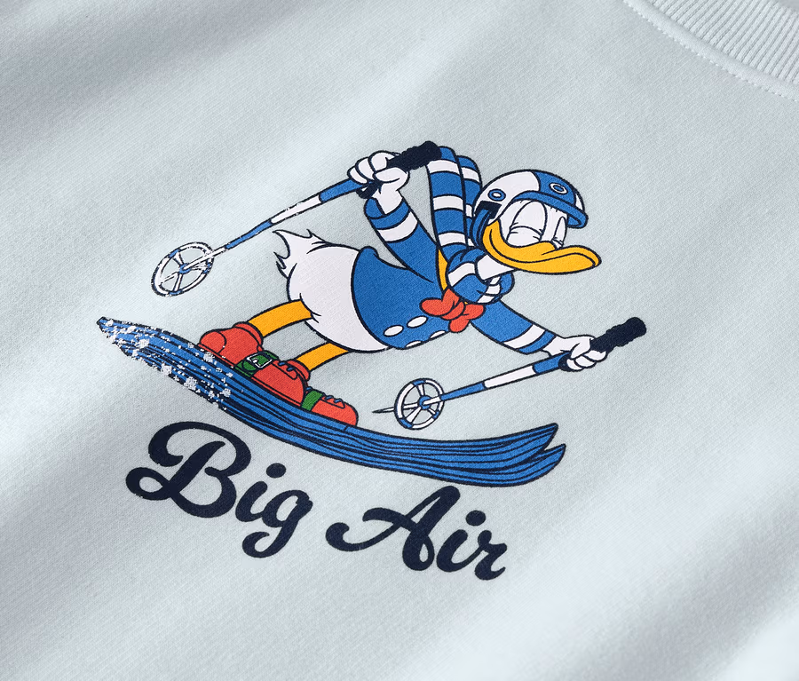 Cartoon-Figur Donald Duck auf Skiern mit der Aufschrift "Big Air".