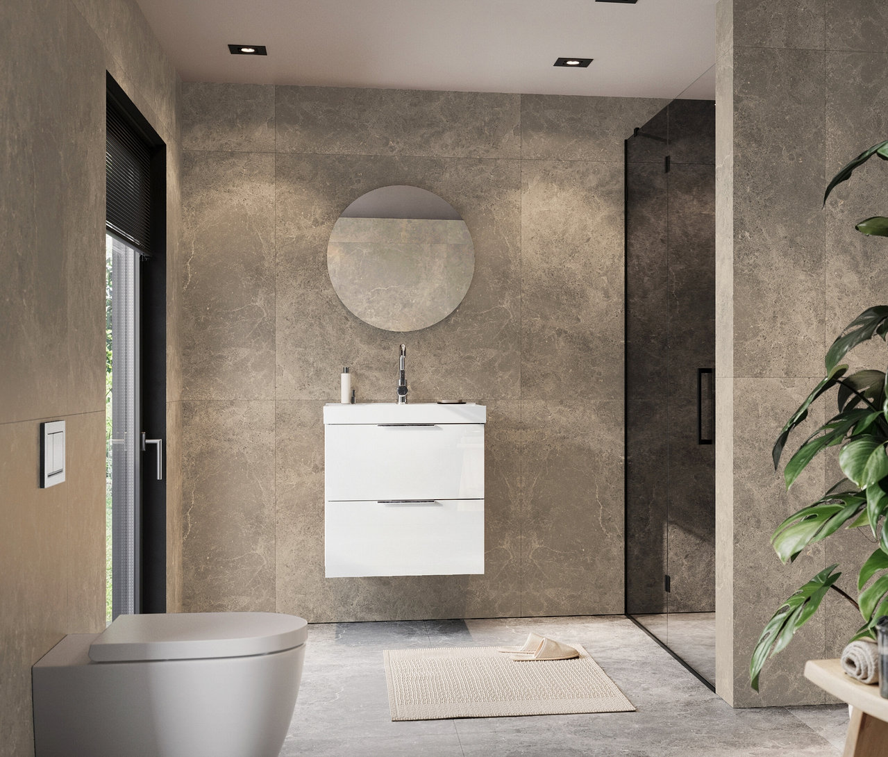 Ein Badezimmer mit grauen Fliesen, einem weißen Waschtisch mit rundem Spiegel, einer Toilette und einer Dusche.